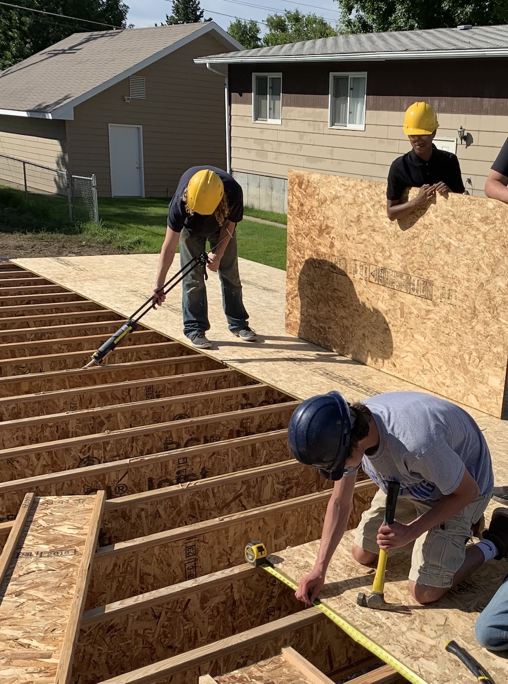 Students work on a house in Great Falls, Montana.