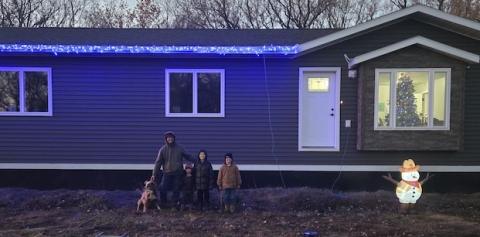 The Hagen family in front of their home.