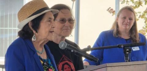 Dolores Huerta behind a podium.